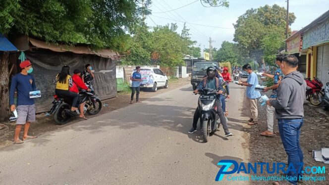 
					Zona Kuning Penjualan Lancar, Pedagang HP Bekas Berbagi Masker